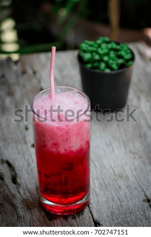 Red ice topped with milk