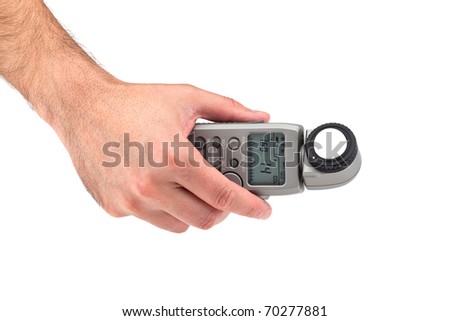 Hand holding a light meter