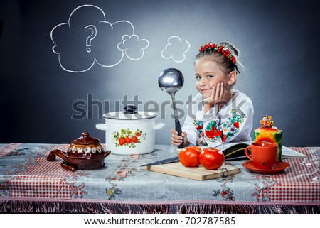 Ukrainian little girl is cooking