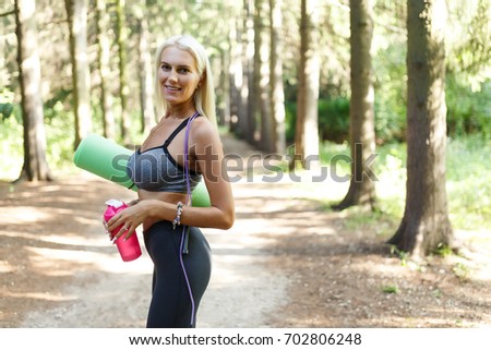Photo of woman in sports clothes