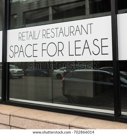Close up look at a Retail/Restaurant Space for Lease sign in a major US city.