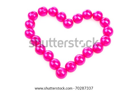 Heart from pink beads isolated on white background
