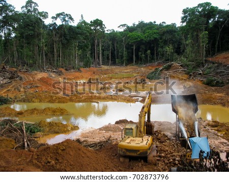 Rainforest destruction. Gold mining place in Guyana, South America. Amazon and Essequibo basin deforestation. Similar as in Brazil,
Venezuela, Suriname, French Guyana, Peru, Colombia. Royalty-Free Stock Photo #702873796