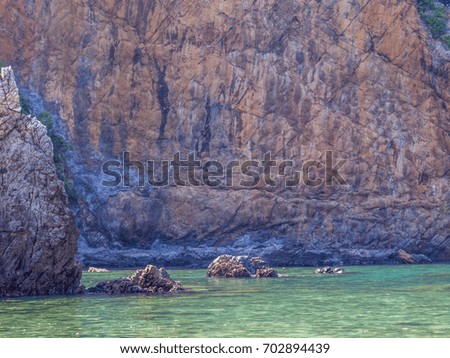 Sea and ancient granite rock texture for summer vacation.