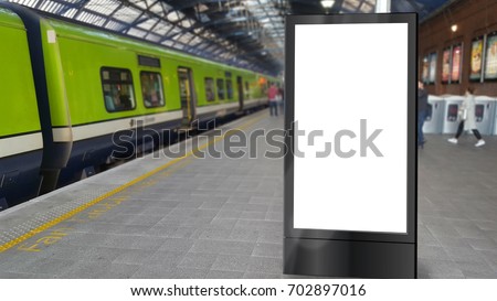 Blank totem sign on a railway platform Royalty-Free Stock Photo #702897016