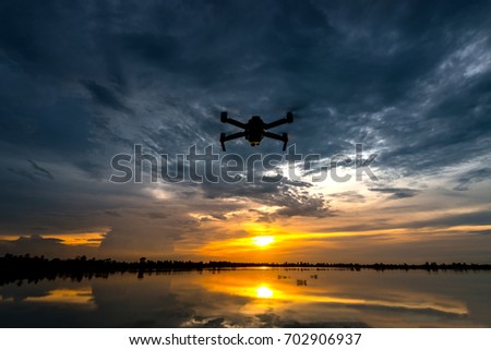 Dark Flying drone and cloud sunset sky