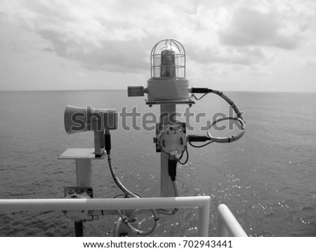Manual fire alarm call point on offshore oil and gas platform.