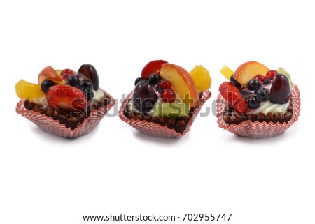 Cake stock images. Fruit tart on a white background. Group of fruit cakes