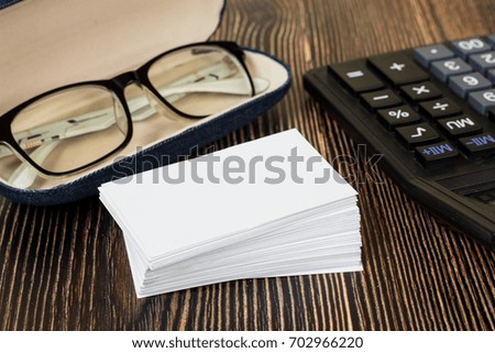 Mockup Business card and office supplies on wood.