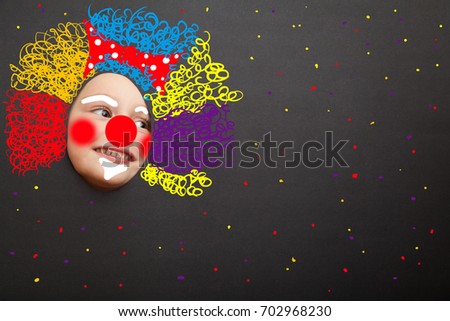 Girl clown with happy joyful expression against the black background. Photo face stand-in cutout