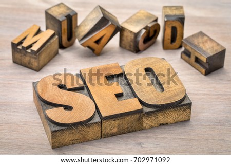 search engine optimization (SEO) - acronym  in vintage letterpress wood type printing blocks on grained wood background