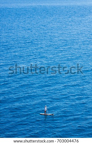 Man on stand up paddle surf