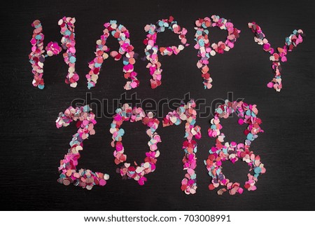 happy 2018 sign with confetti