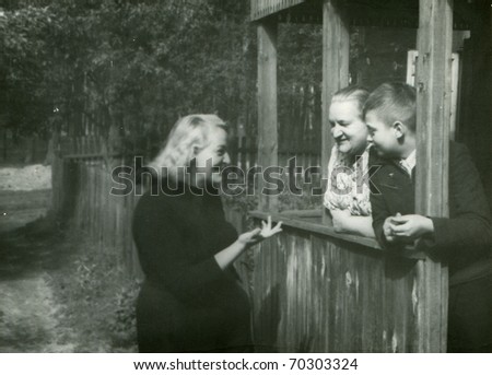 Vintage photo of happy three generations family