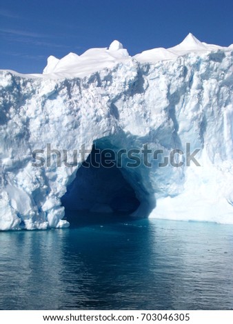 Blue turquoise and white iceberg in Antarctica