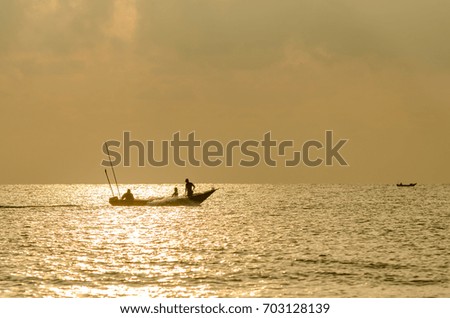 Boat moving split the sea wave during golden morning.