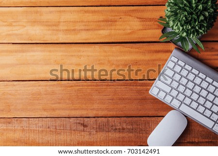 office keyboard and mouse on wood table