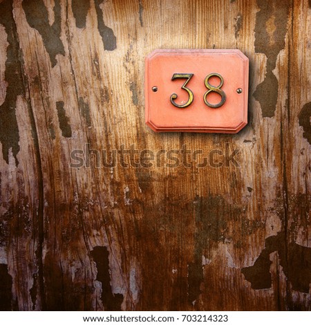 Number38 on a wooden background
