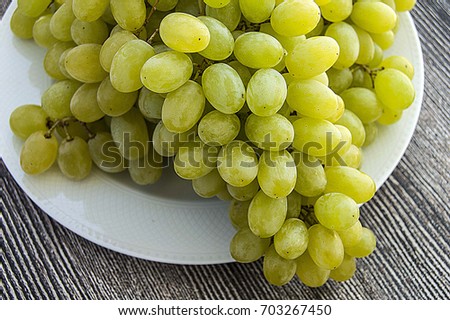 
Very fresh grapes in the basket, bunch of grapes on the wooden floor, grape bunch of pictures in different concepts.Natural grape clusters, vineyards and grapes,
