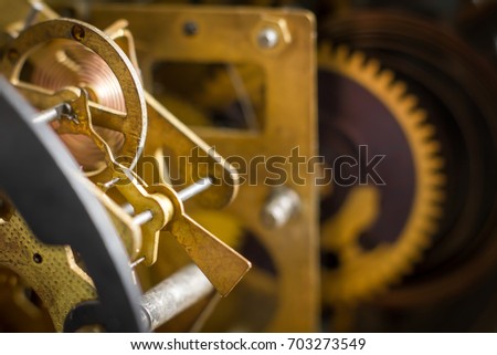 Close view of old clock mechanism with gears and cogs. Conceptual photo for your successful business design. Copy space included. Selective focus