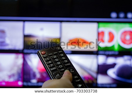 Watching TV and using remote controller