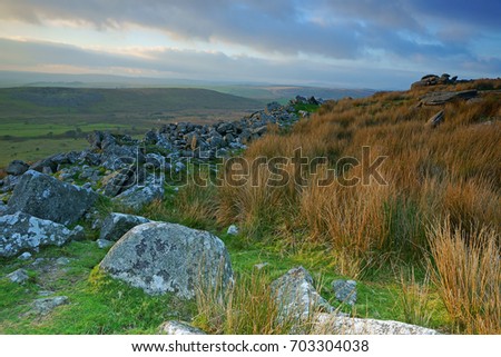 A winter sunset over Stowe's Pound, Bodmin Moor, Cornwall, United Kingdom. The main summit is surrounded by the ruins of a wall which may have been built in Neolithic times.