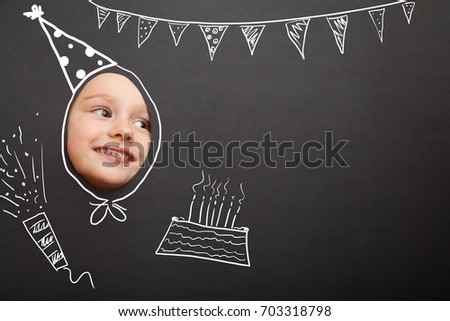 Funny girl in the drawn birthday cap on the black background. Photo face stand-in cutout.