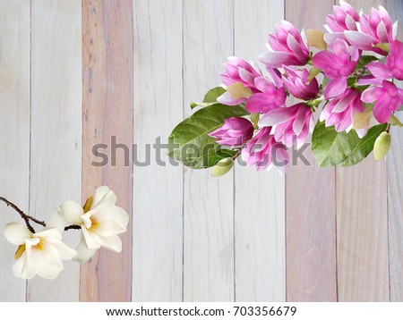 Beautiful magnolia flower bouquet on wooden background.
