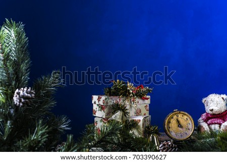 Christmas composition with a Christmas tree and Christmas toys on a dark blue background