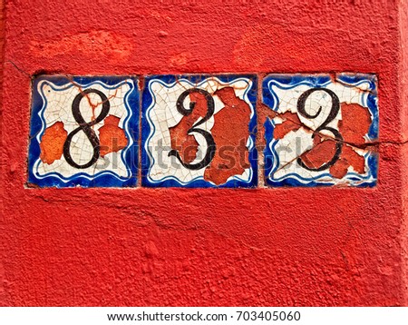 Old Numbers on a Red Wall in the French Quarter