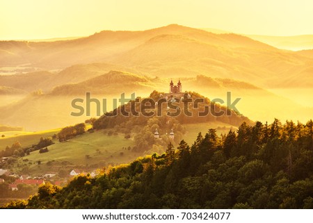 Church on the top of the hill in beautiful sunrise light - fairy tale photo
