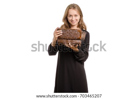 Girl in black dress with jewelry box on white background isolation