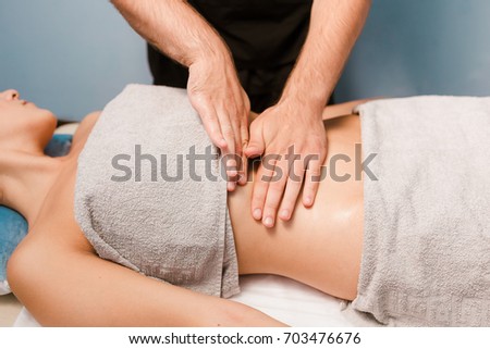 Wellness and anti-cellulite massage of the abdomen