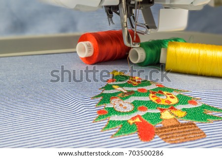 Close up picture Christmas tree full decoration design 
make with embroidery machine on fabric