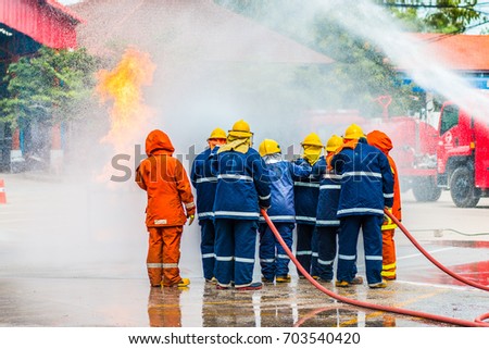 Firefighters training ,firefighters spray water to fire