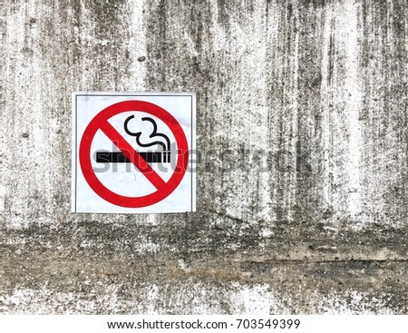 No smoking sign on concrete wall background