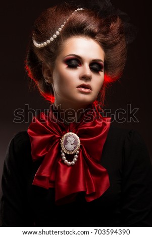 Girl in gothic art style with creative makeup. image for Halloween. Photo taken in studio