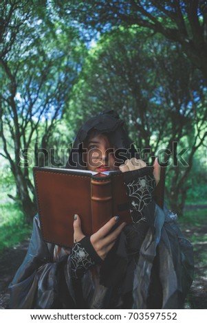 Image of witch with book
