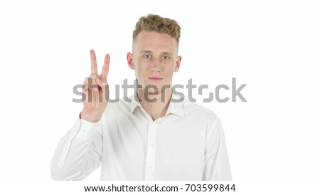 Victory Sign by Young Businessman, White Background