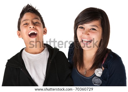 Two hispanic kids laughing on white background