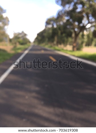 blur picture of paved road
