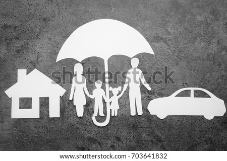 Paper silhouette of family under umbrella, house and car on grey background. Life insurance concept
