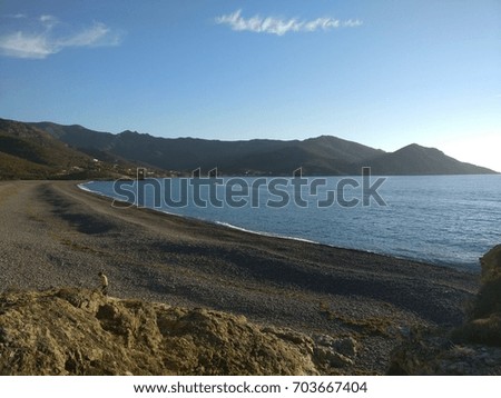 this picture represents a sunny day in Corse with a beautiful beach 