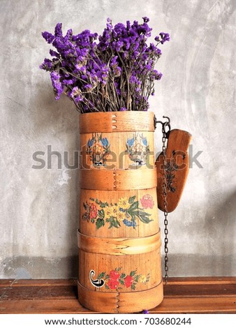 Dried purple flowers decorated In bamboo basket, beautiful pattern.