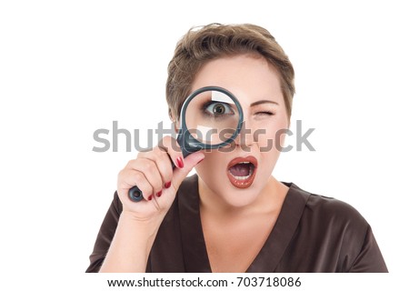 Businesswoman looking through magnifying glass isolated on white background
