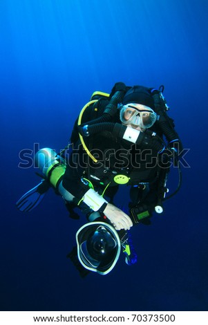 Technical Scuba Diver with Rebreather and SLR Camera