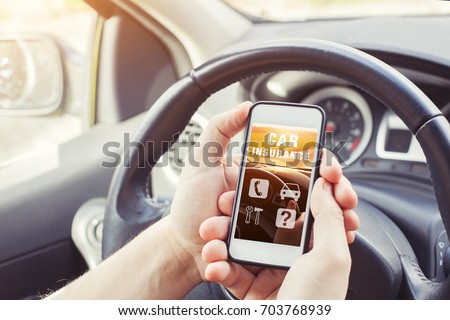 car insurance concept, driver reading website on smartphone Royalty-Free Stock Photo #703768939