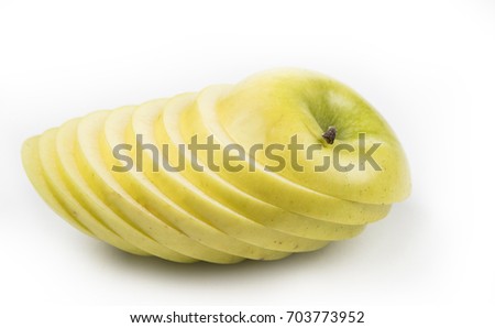 Apple cut on thin slices on the white background