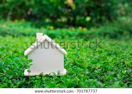 Photo of small wooden home no body on green yard and fresh background use for graphic resource