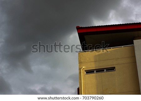 Clouds and light hit the school building.